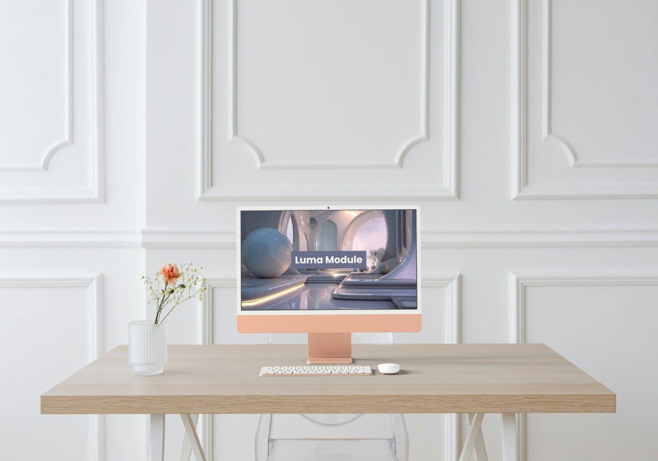 Modern computer setup on a desk with a decorative wall in the background